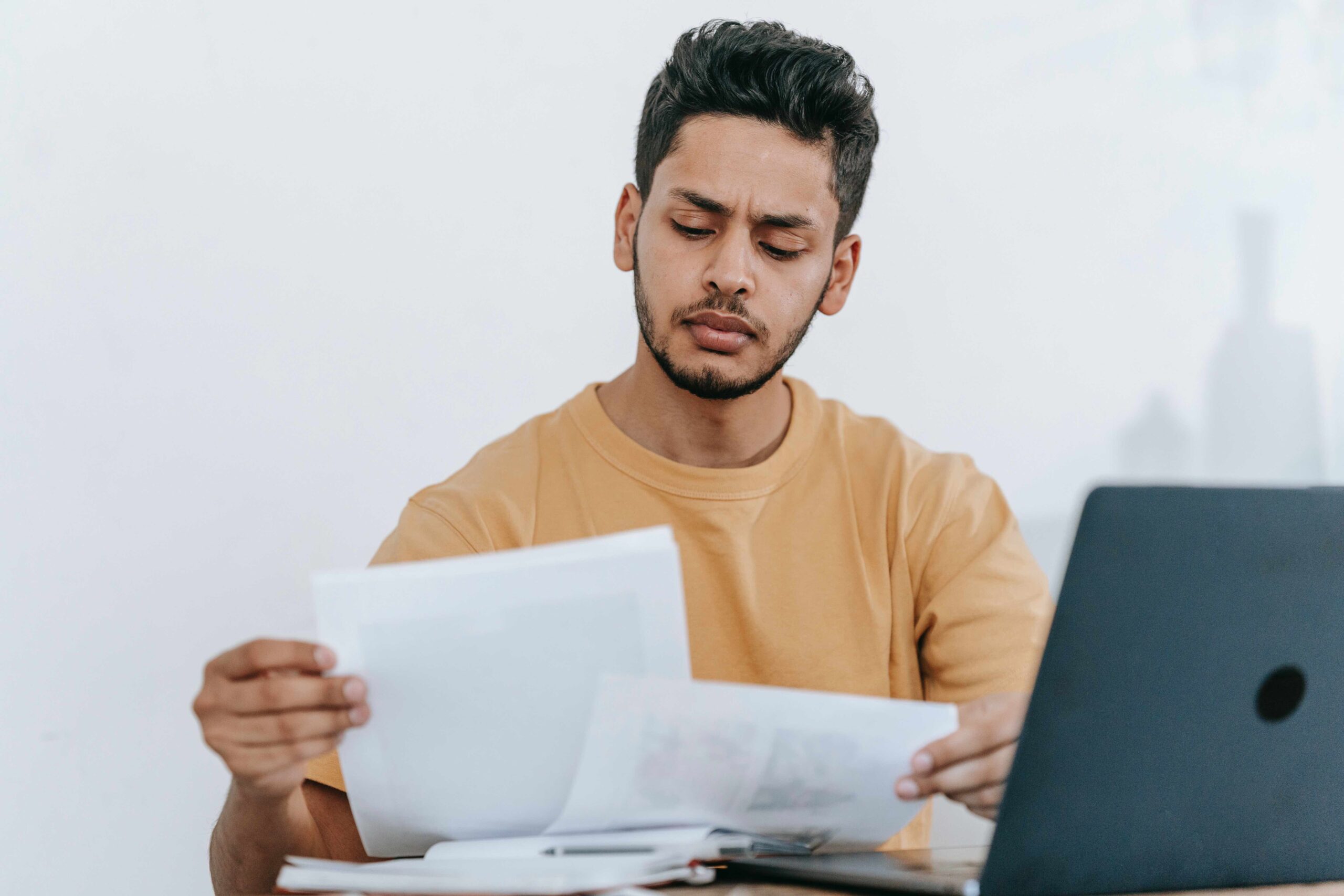 man looking at paper